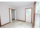 A brightly lit bedroom with a closet and access to the outside at 622 Enon Rd, Oxford, NC 27565