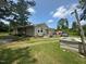 Home's exterior showing the yard, siding, deck and storage shed at 625 Revell Rd, Selma, NC 27576