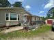Exterior of home showing a small deck, bay window and brick accents at 625 Revell Rd, Selma, NC 27576