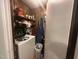 Laundry area with washing machine, shelving, and storage at 625 Revell Rd, Selma, NC 27576