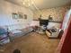 Spacious living room with floral wallpaper, neutral carpet and comfortable seating at 625 Revell Rd, Selma, NC 27576