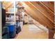 Unfinished attic featuring wooden beams and visible storage solutions at 6708 Wavcott Dr, Fuquay Varina, NC 27526