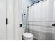 Full bathroom featuring shower with curtain and a toilet at 6708 Wavcott Dr, Fuquay Varina, NC 27526
