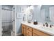 Charming bathroom featuring a dual sink vanity, framed mirrors, and a shower at 6708 Wavcott Dr, Fuquay Varina, NC 27526