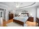 Spacious bedroom features a trey ceiling, hardwood floors, and great natural light at 6708 Wavcott Dr, Fuquay Varina, NC 27526
