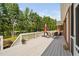 Lovely deck features outdoor seating with views of the lake and mature trees at 6708 Wavcott Dr, Fuquay Varina, NC 27526