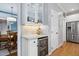 Butler's pantry has glass cabinets, mini fridge, and granite countertop perfect for entertaining at 6708 Wavcott Dr, Fuquay Varina, NC 27526