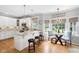 Bright eat-in kitchen boasts granite countertops, stainless appliances, and modern lighting at 6708 Wavcott Dr, Fuquay Varina, NC 27526