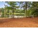 Stunning lake view with seating around a fire pit, creating a perfect spot for relaxation at 6708 Wavcott Dr, Fuquay Varina, NC 27526