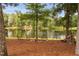 Tranquil lake view with a fire pit area and comfortable seating, perfect for enjoying nature at 6708 Wavcott Dr, Fuquay Varina, NC 27526