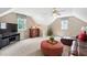 Bright living room with ceiling fan, natural light, and comfortable seating at 6708 Wavcott Dr, Fuquay Varina, NC 27526