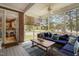 Relaxing screened porch with comfortable seating and view of backyard at 6708 Wavcott Dr, Fuquay Varina, NC 27526