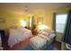 Relaxing bedroom featuring a ceiling fan, hardwood floors, and sunny window at 6717 Valley Dr, Raleigh, NC 27612