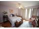 Comfortable bedroom with a ceiling fan, hardwood floors, and lots of natural light at 6717 Valley Dr, Raleigh, NC 27612