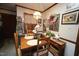 Cozy breakfast nook features wood table and chairs, accent furniture, and decor at 6717 Valley Dr, Raleigh, NC 27612