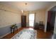 Traditional dining room with a chandelier, wainscoting, and hardwood floors at 6717 Valley Dr, Raleigh, NC 27612