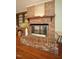 Close-up of the living room fireplace, showcasing its design and brick surround at 6717 Valley Dr, Raleigh, NC 27612