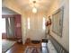 Inviting foyer featuring a beautiful hardwood floor, a hall bench, and bright decor at 6717 Valley Dr, Raleigh, NC 27612