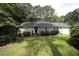Charming home featuring a well-manicured lawn, tidy landscaping, and a welcoming facade at 6717 Valley Dr, Raleigh, NC 27612