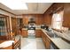 Eat-in kitchen features wood cabinets, stainless steel appliances, and a bright, airy feel at 6717 Valley Dr, Raleigh, NC 27612