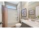 Well-lit bathroom featuring a shower-tub combo, marble countertops, and modern fixtures at 70 Freedom Heights Ln # 149, Smithfield, NC 27577