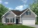 Charming one-story home featuring stone accents, gray siding, a two-car garage, and manicured landscaping at 70 Freedom Heights Ln # 149, Smithfield, NC 27577