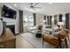 Bright, open living area with fireplace, large windows, and comfortable seating at 700 Ben Ledi Ct, Raleigh, NC 27603