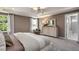 Relaxing main bedroom showcasing lots of natural light, carpet, and ensuite bathroom at 700 Ben Ledi Ct, Raleigh, NC 27603