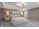 Serene main bedroom with neutral tones, tray ceiling, and plush carpeting at 700 Ben Ledi Ct, Raleigh, NC 27603