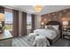 Main bedroom featuring plush bedding, neutral color palette, and lots of natural light at 700 Ben Ledi Ct, Raleigh, NC 27603