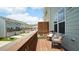Relax on this townhouse balcony with stylish seating and a privacy screen overlooking the community at 713 Traditions Grande Blvd, Wake Forest, NC 27587