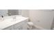 Modern bathroom features a white vanity with gray tile backsplash and a sleek faucet at 713 Traditions Grande Blvd, Wake Forest, NC 27587