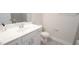 Modern bathroom features a white vanity with gray tile backsplash and a sleek faucet at 713 Traditions Grande Blvd, Wake Forest, NC 27587