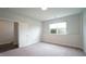 Spacious bedroom with cozy carpet, a window and an entrance to another room at 713 Traditions Grande Blvd, Wake Forest, NC 27587