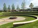 Well maintained outdoor fire pit with seating and grassy area at 713 Traditions Grande Blvd, Wake Forest, NC 27587