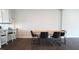 Stylish dining area with modern seating and a bar counter in the kitchen at 713 Traditions Grande Blvd, Wake Forest, NC 27587