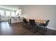 Dining area featuring modern table and chairs, next to an open kitchen concept at 713 Traditions Grande Blvd, Wake Forest, NC 27587