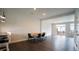 Open concept dining area with modern table, seating, and stylish pendant lighting at 713 Traditions Grande Blvd, Wake Forest, NC 27587