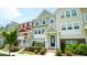 Colorful townhome exterior with well maintained landscaping and inviting entryway at 713 Traditions Grande Blvd, Wake Forest, NC 27587