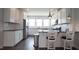 Bright kitchen featuring stainless steel appliances, granite counters, and pendant lighting at 713 Traditions Grande Blvd, Wake Forest, NC 27587