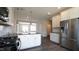 Open kitchen with stainless steel appliances, center island, and pendant lighting at 713 Traditions Grande Blvd, Wake Forest, NC 27587