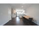 Bright open kitchen features white cabinets and modern appliances with a dining area at 713 Traditions Grande Blvd, Wake Forest, NC 27587