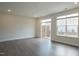 Bright living room features large windows and a sliding glass door to the balcony at 713 Traditions Grande Blvd, Wake Forest, NC 27587