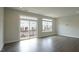 Open living room with sliding glass door and plenty of natural light at 713 Traditions Grande Blvd, Wake Forest, NC 27587