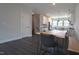 Spacious living area with modern dining table leading into an open kitchen at 713 Traditions Grande Blvd, Wake Forest, NC 27587