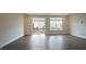 Bright living room with sliding glass door providing access to a private deck at 713 Traditions Grande Blvd, Wake Forest, NC 27587