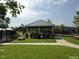 Community picnic pavilion with picnic tables and manicured lawn at 713 Traditions Grande Blvd, Wake Forest, NC 27587