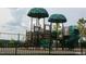 Community playground featuring slides and covered play areas at 713 Traditions Grande Blvd, Wake Forest, NC 27587