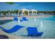 Community pool featuring lounge chairs and fountains at 713 Traditions Grande Blvd, Wake Forest, NC 27587
