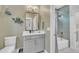 Charming bathroom featuring a modern vanity, decorative mirror, and bathtub with stylish green tiling at 800 Wilcox St, Raleigh, NC 27607